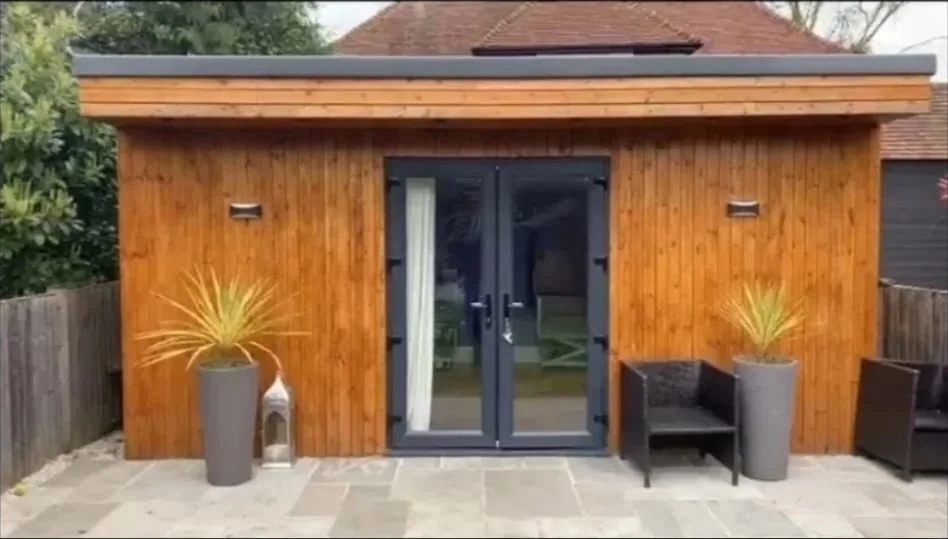 Garden room with cedar cladding and flat roof — garden room builders Richmond