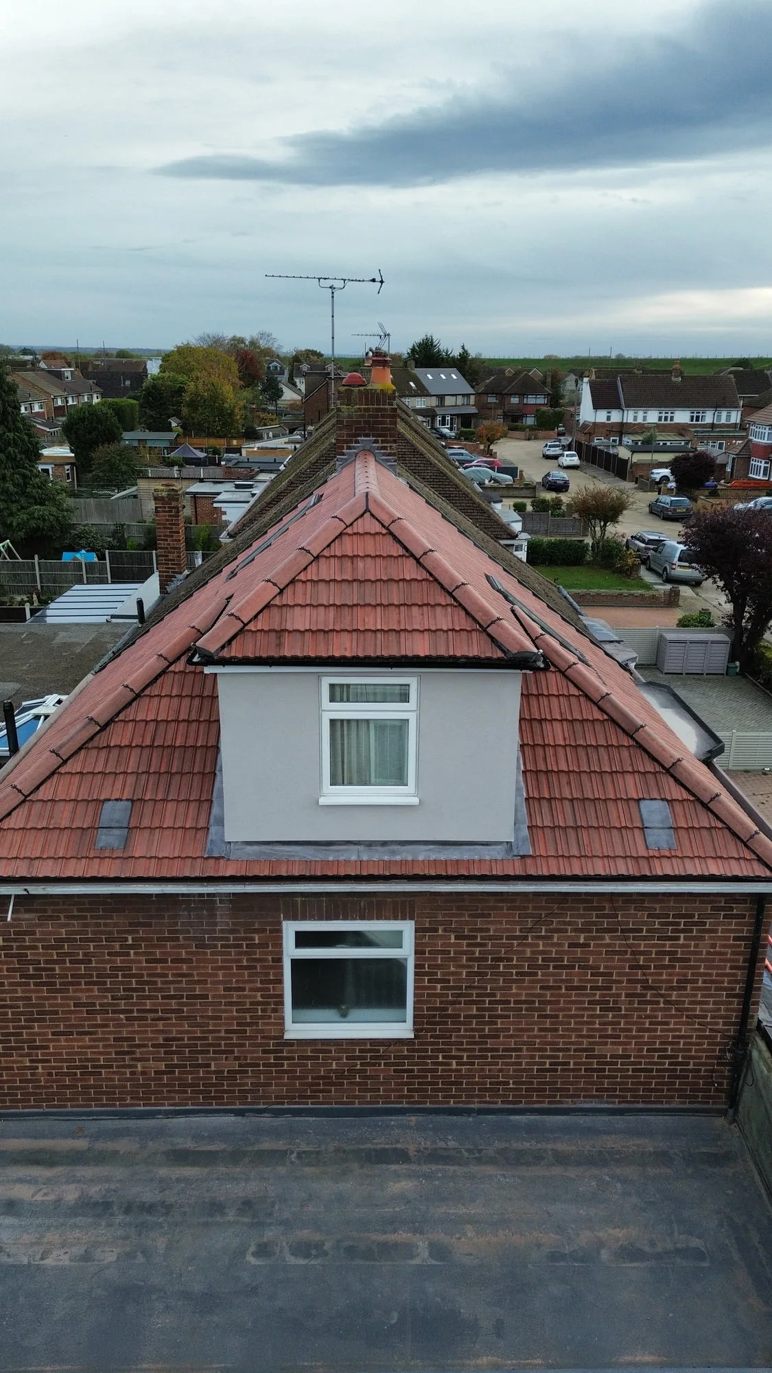 Pitched roof dormer replacement aerial view — roofing contractors SW London