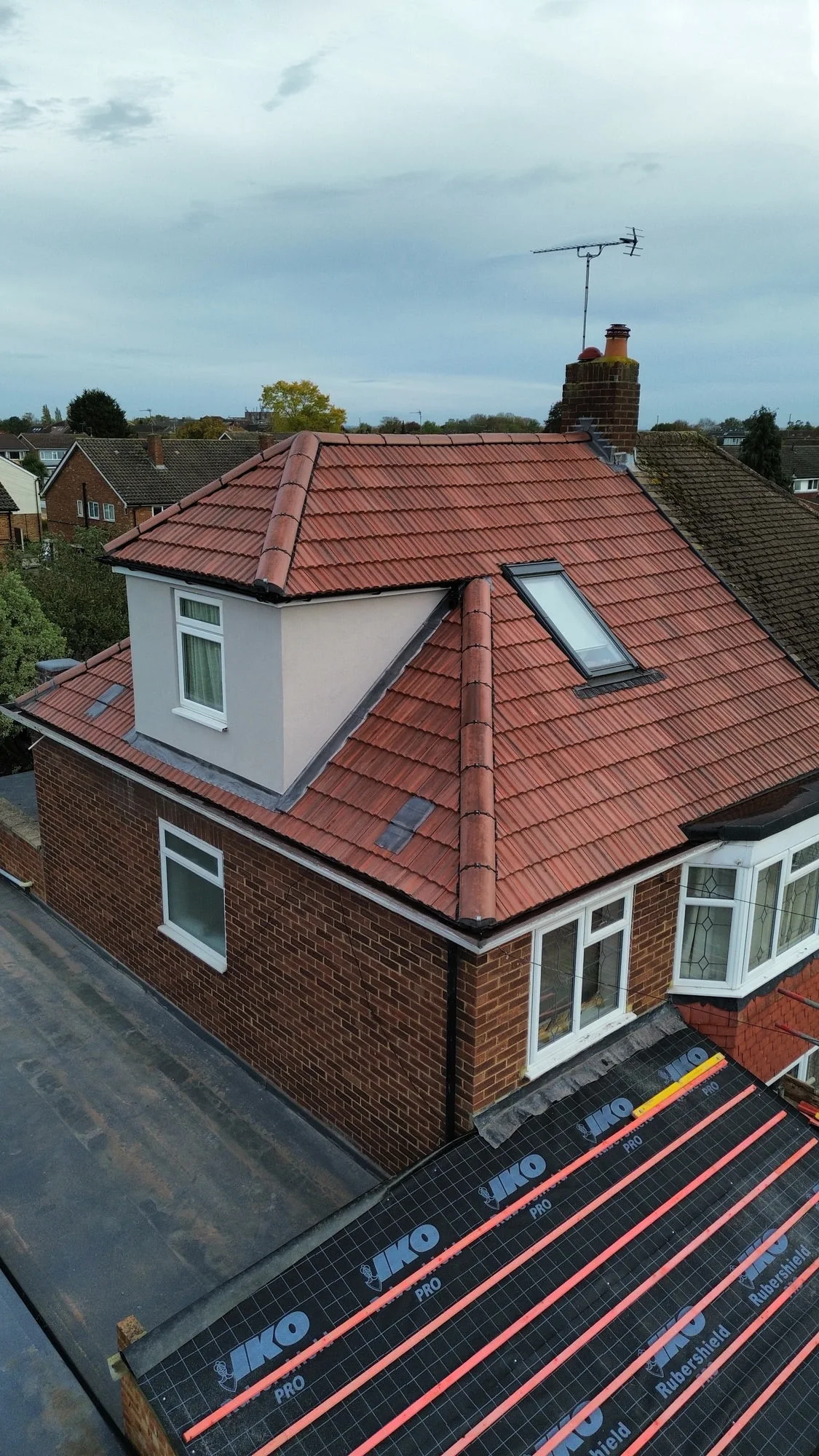 Pitched roof with dormer and Velux window installation — SW London roofers